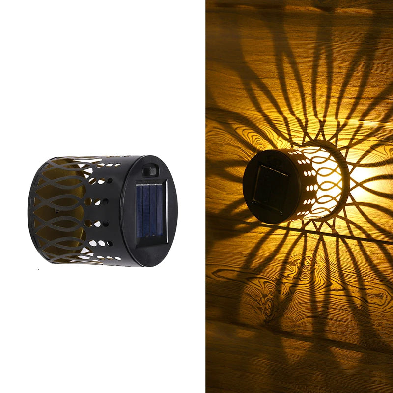 Una lámpara de pared mandala solar proyecta intrincadas sombras florales sobre una superficie de madera.