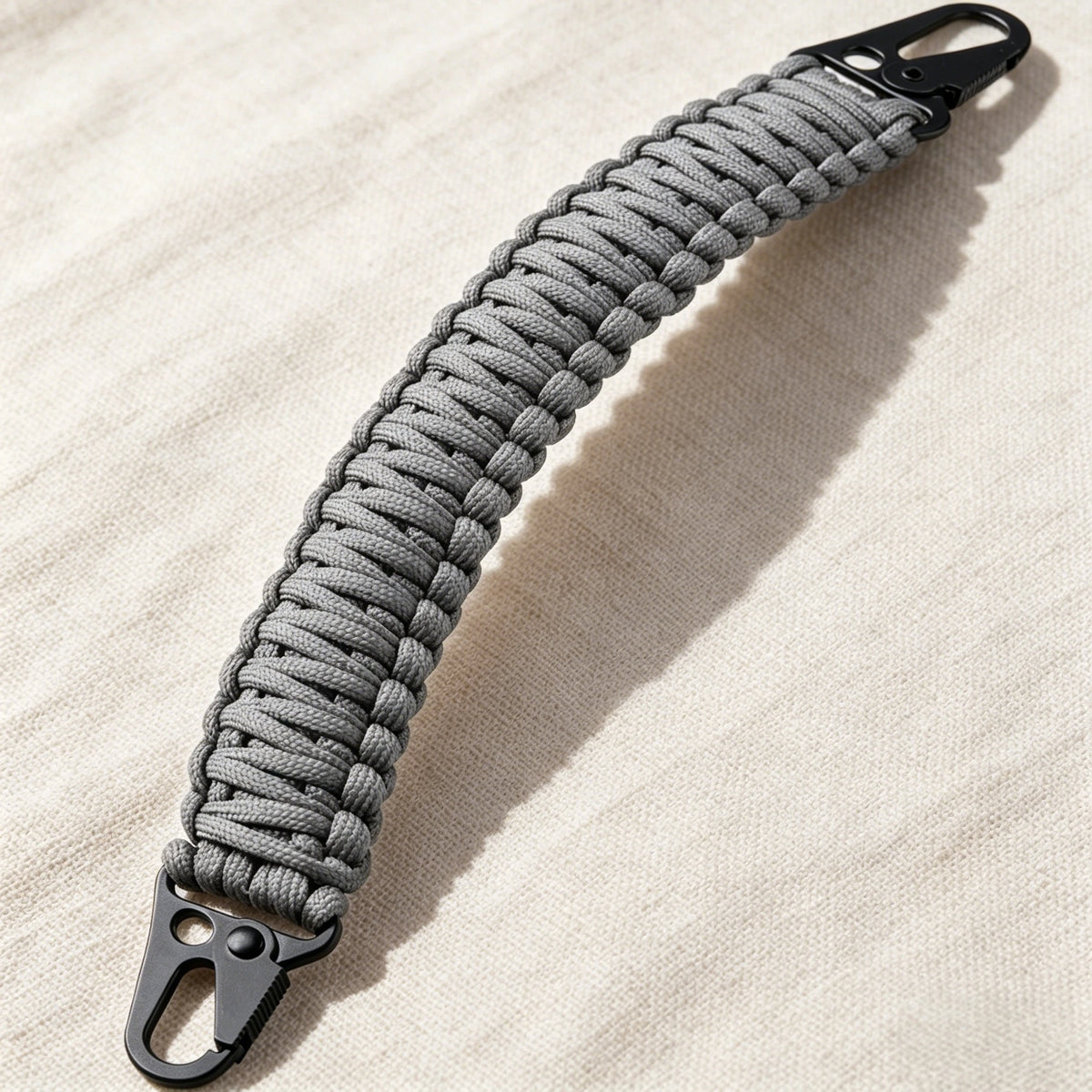 Gray paracord handle with metal hooks for tactical bags and backpacks