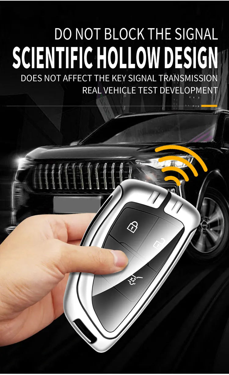 A hand holds a silver car key case with a digital keypad, set against a dark background with a car in the blurred background.