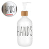 White refillable soap dispenser bottle with black text reading HANDS