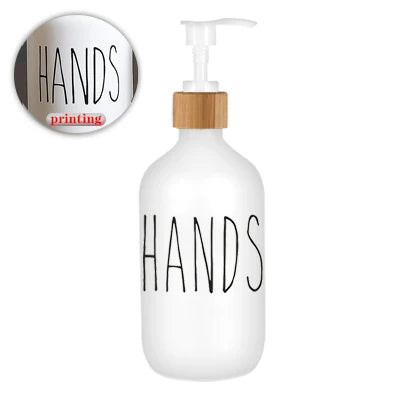 White refillable soap dispenser bottle with black text reading HANDS