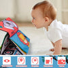 A baby is looking at a high-contrast crinkle cloth book with a tummy time mirror toy.