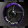 Reflective purple and white decals on a black motorcycle wheel rim for a Yamaha MT-07.