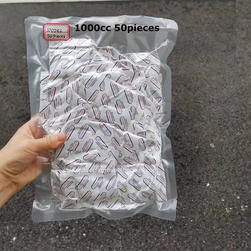 A clear plastic bag contains 50 pieces of food grade oxygen absorbers for long-term dry food storage.