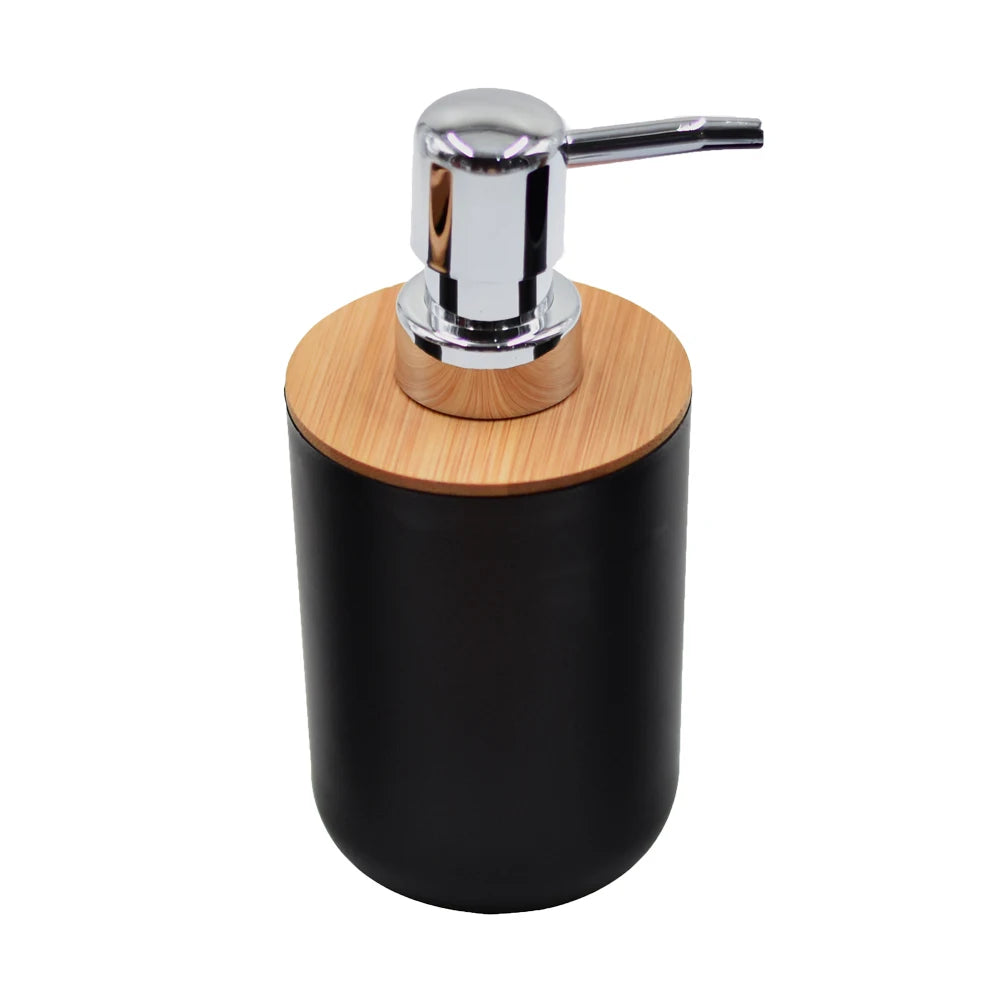 A modern bathroom organizer set featuring a chrome soap dispenser mounted on a black cylindrical base with a bamboo top.