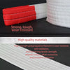 Red and white heavy duty tow rope with reflective stripes showing its durable material.