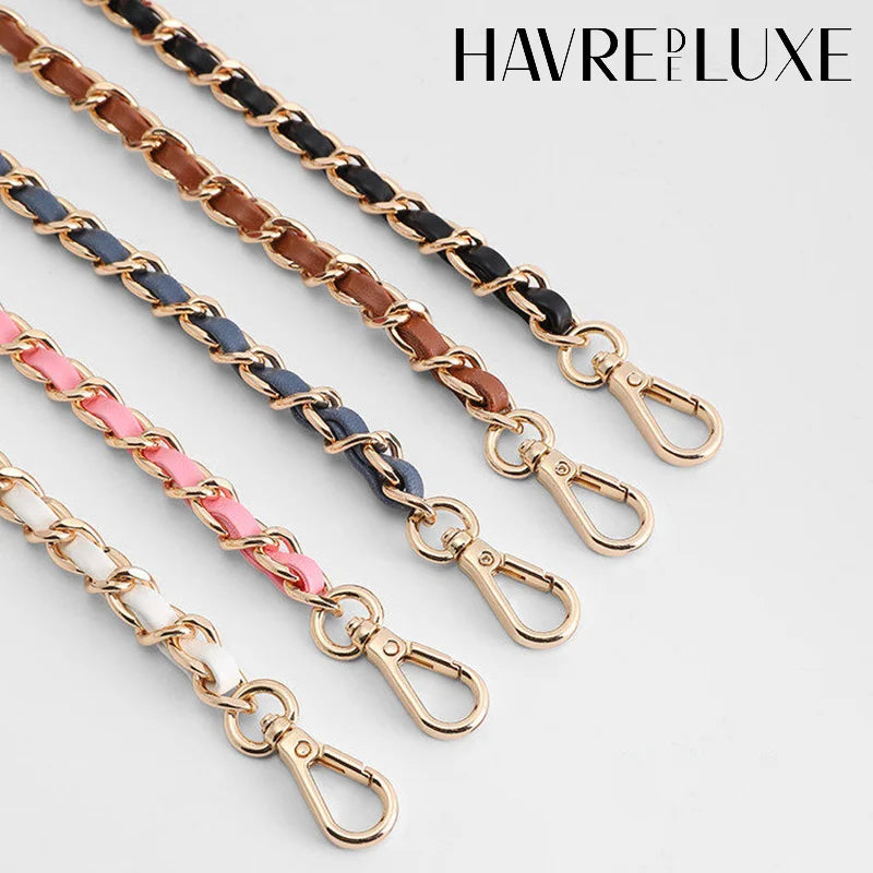 Several strands of durable metal shoulder strap buckles in gold and black leather are displayed.