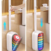 A hand is shown picking up a handle from a wall-mounted dispenser, which automatically opens and closes.