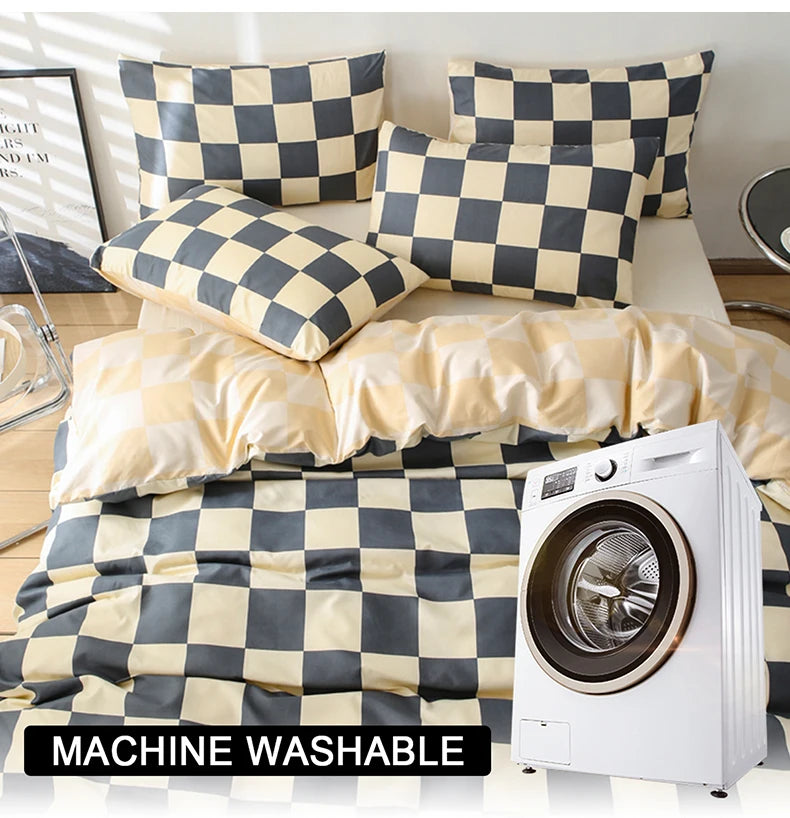 A checkered print bedding set with a duvet cover and pillows displayed next to a white washing machine.