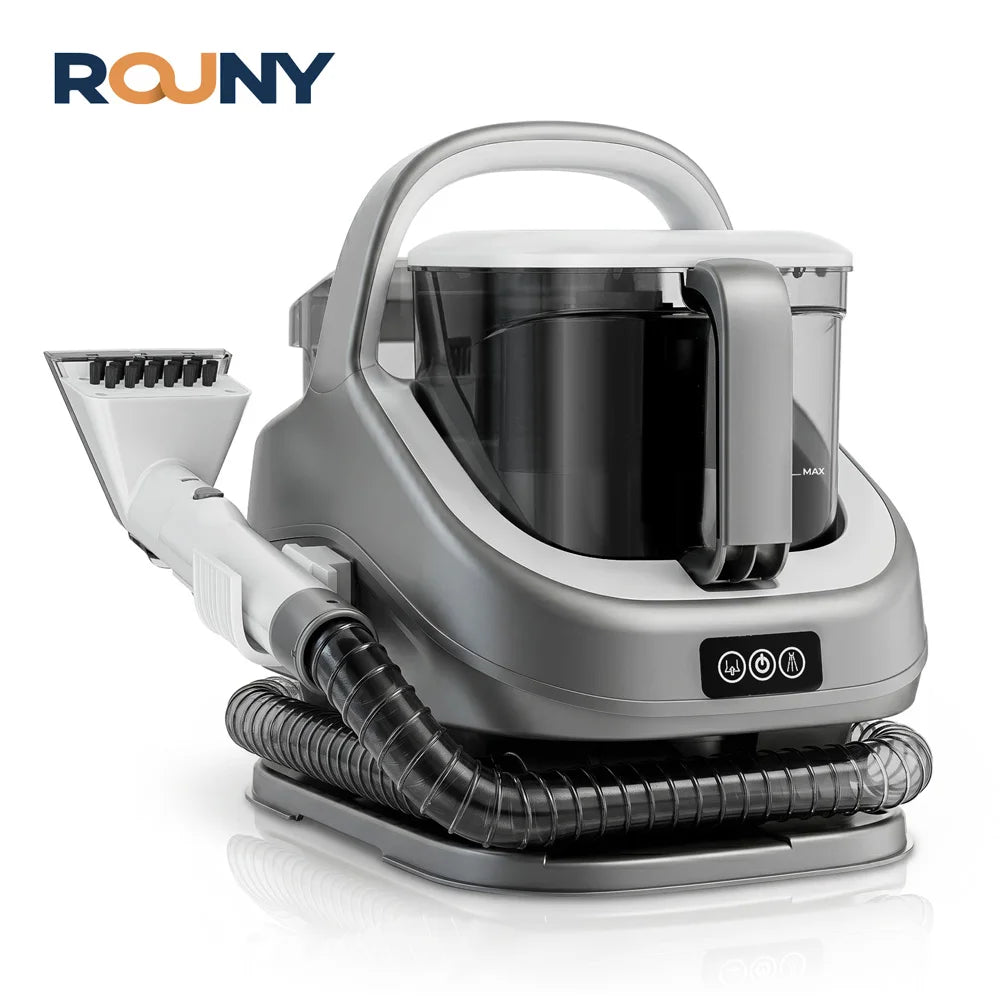 A gray handheld carpet and upholstery steam cleaner with a clear tank and hose is shown on a surface.