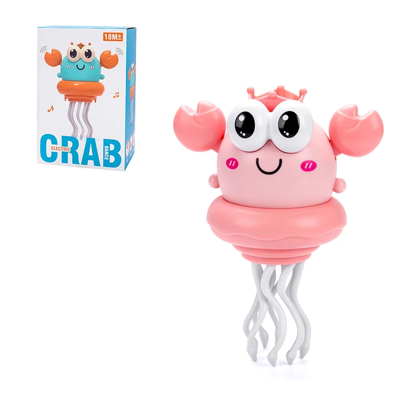 A pink interactive dancing crab toy with large eyes and wavy legs is shown next to its packaging.