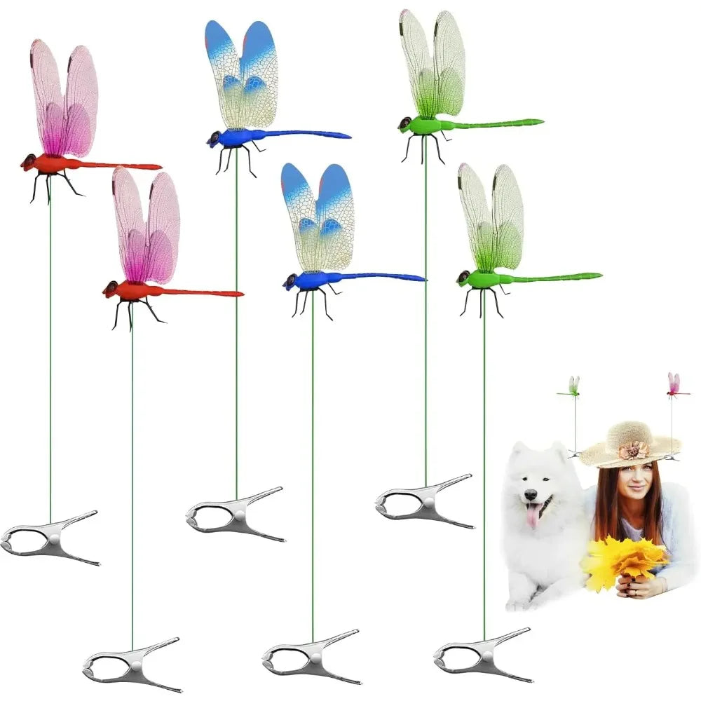 A collection of lifelike dragonfly garden decor clips in various colors and sizes, suspended by thin wires.