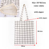 White checkered canvas tote bag with zipper and handles, shown flat.
