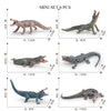 A mini set of six realistic animal figurines, including a dinosaur, a crocodile, and other wildlife creatures.