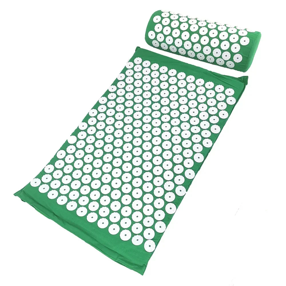 A green acupressure mat and pillow set with white dots for pain relief and relaxation.