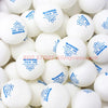 A close-up view of a set of white Sanwei ABS TR table tennis balls.
