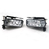 A pair of clear automotive fog light assemblies for a Cadillac Escalade, featuring integrated bulbs and a black housing.