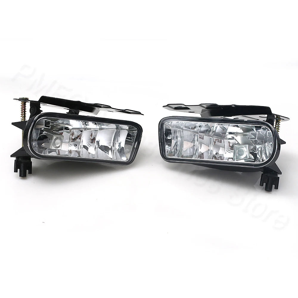 A pair of clear automotive fog light assemblies for a Cadillac Escalade, featuring integrated bulbs and a black housing.
