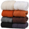 A pack of eight colored wool roving bundles for needle felting, including white, orange, and various shades of gray and brown