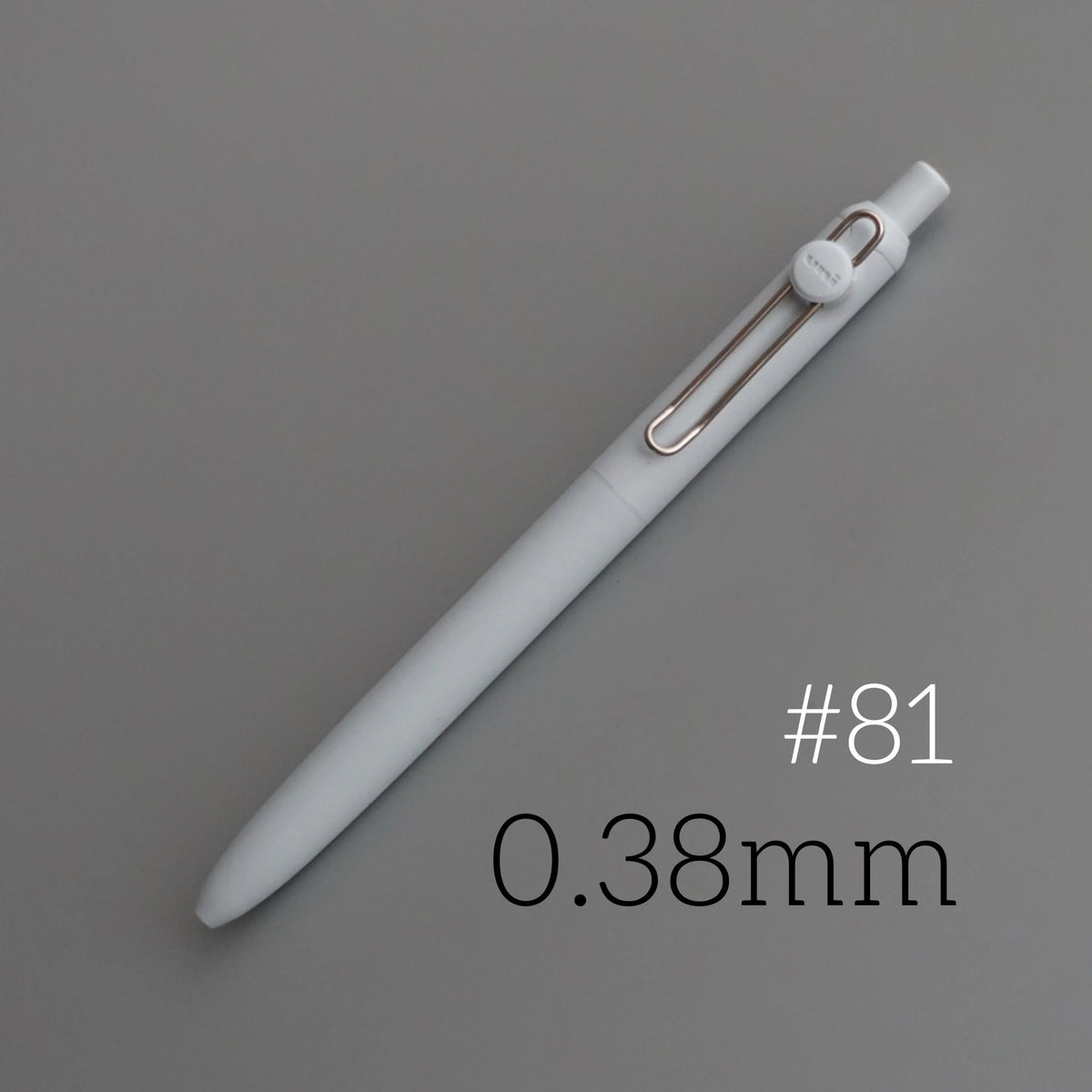 A white Uni ZENTO quick-dry gel pen is shown diagonally against a gray background, with the size marked as 0.38mm.