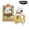 A white plush toy monster with gold armor and funny teeth is shown next to its packaging.