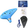 Blue ceramic ocarina with a music book and storage bag shown from the side.