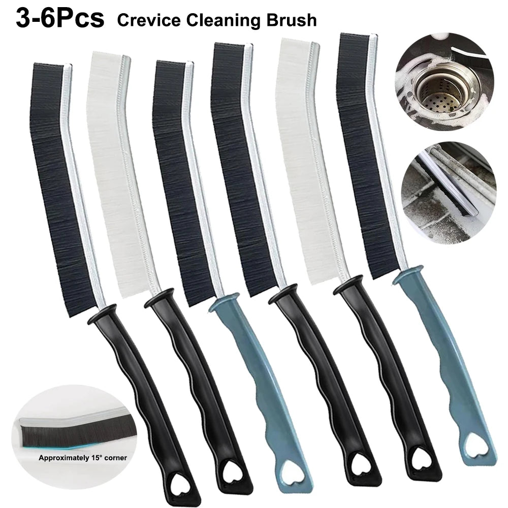 A set of six black and white crevice cleaning brushes for tight spaces.