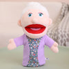 A soft plush hand puppet of an elderly man with white hair and a red mouth, wearing a purple jacket.