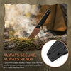 A full tang fixed blade knife with a brown blade and G10 handle is shown emerging from a Kydex sheath in a natural outdoor se
