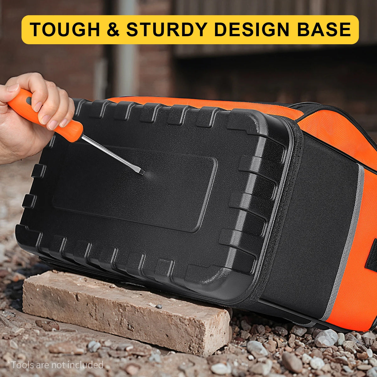 A hand is using a tool to open a tough and sturdy design base of an orange and black tool bag.