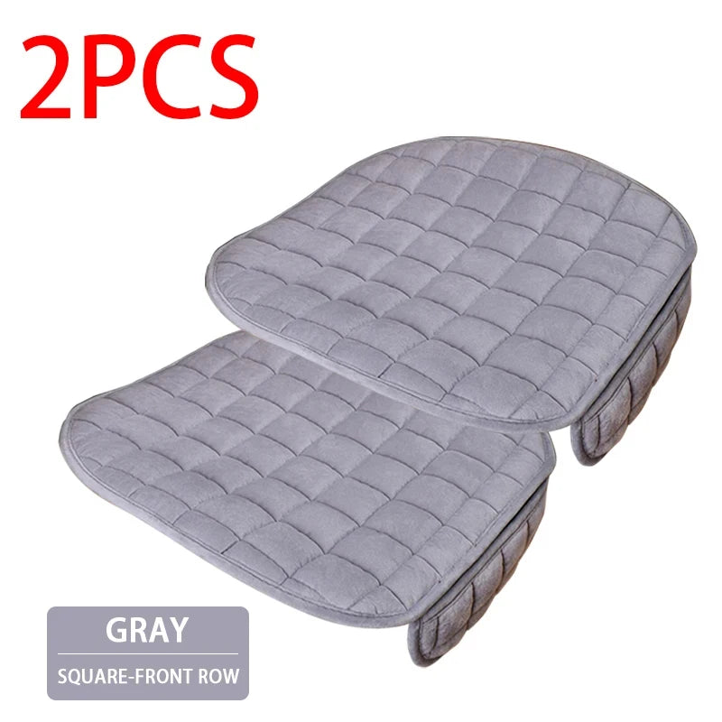 Two gray quilted car seat covers with a square-front row design