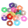 A collection of colorful acrylic spacer beads in various shades including purple, pink, green, and orange.