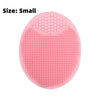 A pink silicone facial mask bowl with a textured surface and built-in tray.