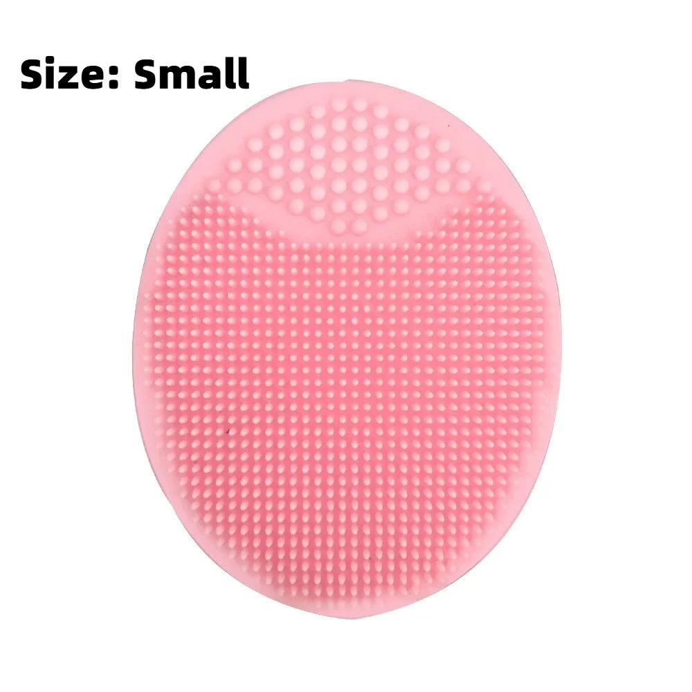 A pink silicone facial mask bowl with a textured surface and built-in tray.