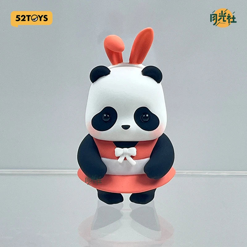 A cute blind box panda figure with white fur, black patches, and an orange-red outfit.