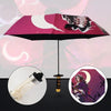 A folding umbrella featuring a Demon Slayer theme with a pink and white crescent moon design.
