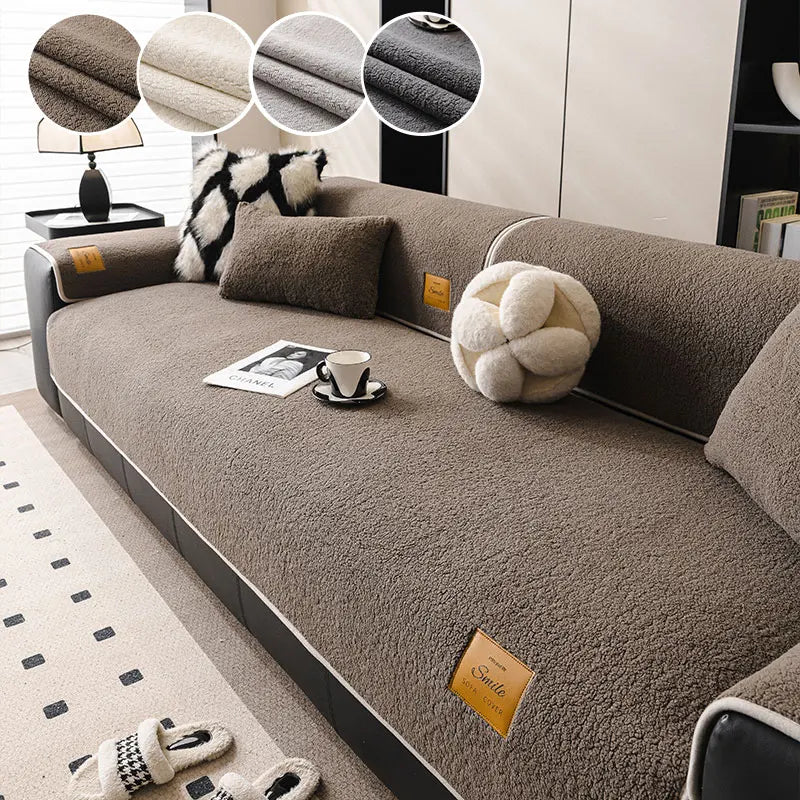 A cozy anti-slip lamb fleece sofa mat in brown fabric with decorative pillows and a cup on a modern sofa.