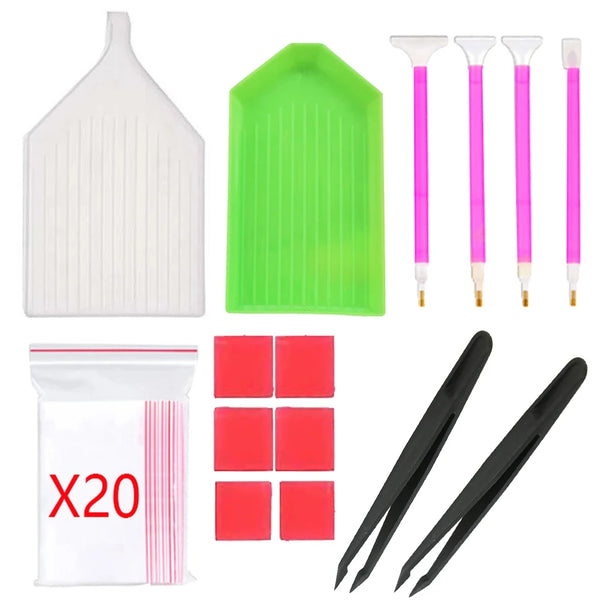 Un kit de fournitures pour la peinture sur diamant comprenant un applicateur blanc, un plateau vert et plusieurs outils roses