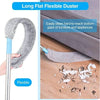 A long flat flexible duster brush with an adjustable handle is shown cleaning dust from the bottom gaps of furniture.