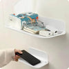 A white wall shelf holds various items including a box, eyeglasses, and a smartphone.