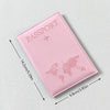 A pink PU leather passport holder featuring a faint world map design and an airplane icon.