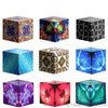 A collection of nine colorful magnetic fidget cubes in various geometric shapes and patterns.
