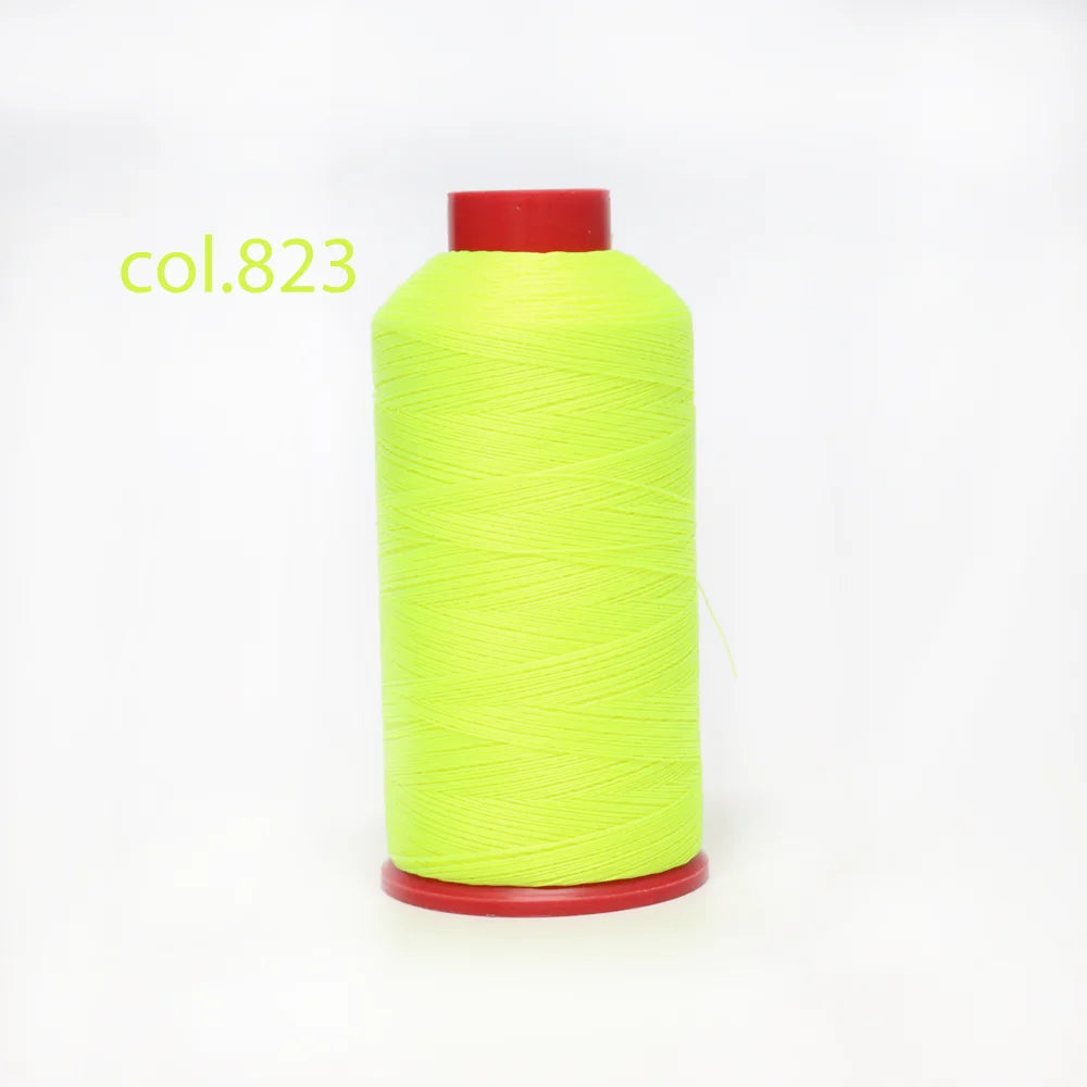 A spool of bright lime green heavy-duty nylon bonded thread with a red cap.