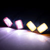A set of three bright LED spotlights illuminating a surface against a dark background.