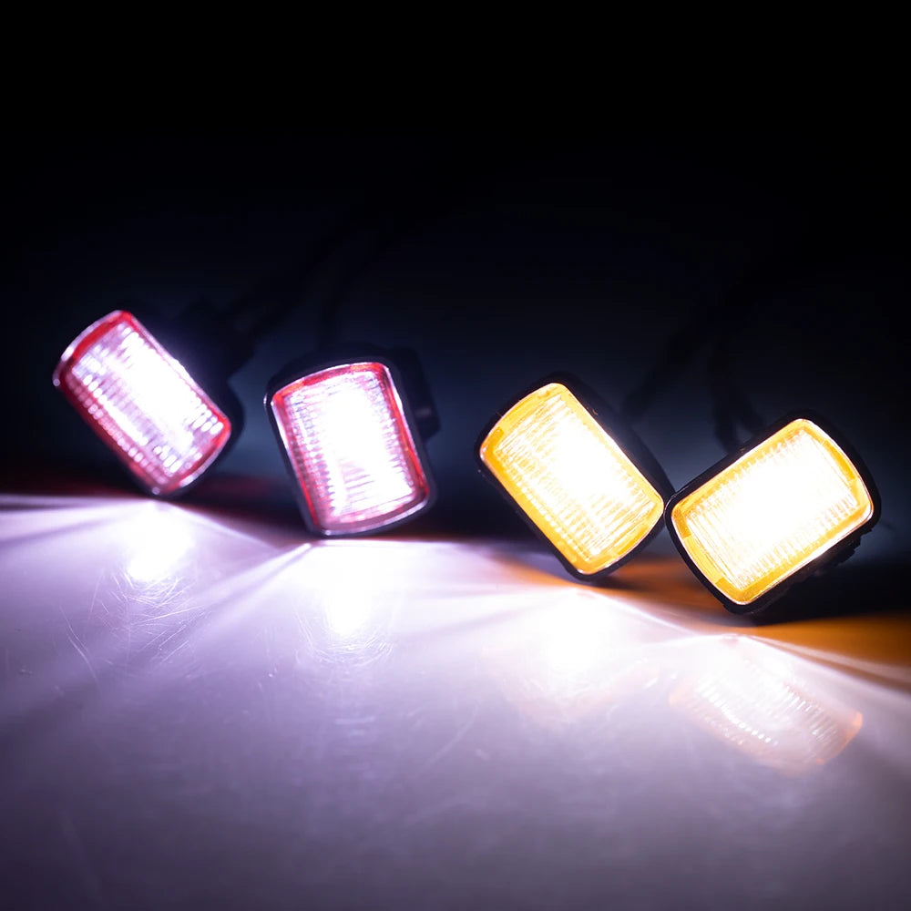 A set of three bright LED spotlights illuminating a surface against a dark background.