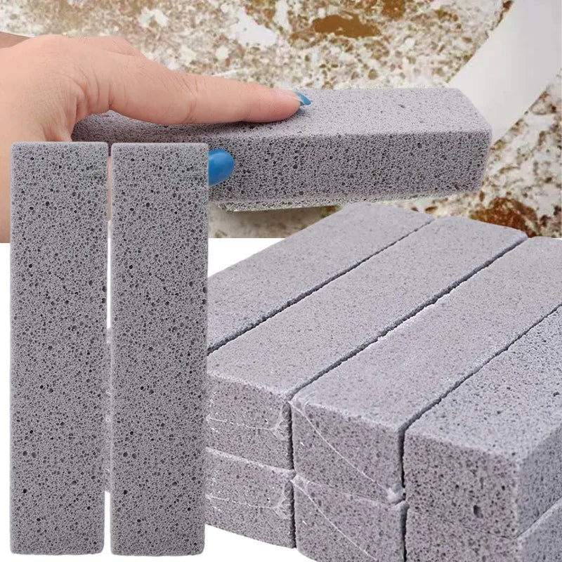 A hand is holding a gray pumice stone cleaning stick, showing its texture and size.