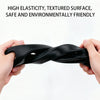 A hand is holding a black, textured elastic strap or gap filler.