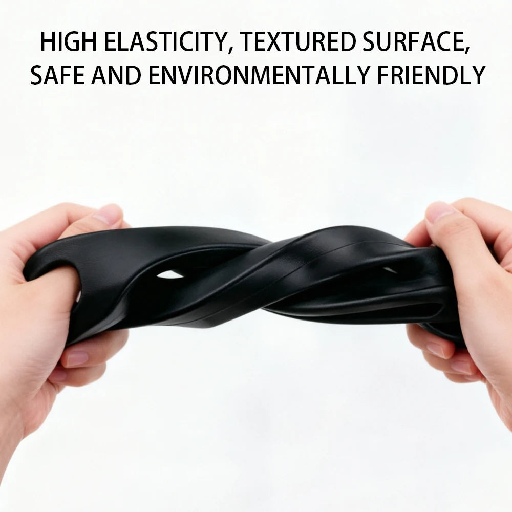 A hand is holding a black, textured elastic strap or gap filler.