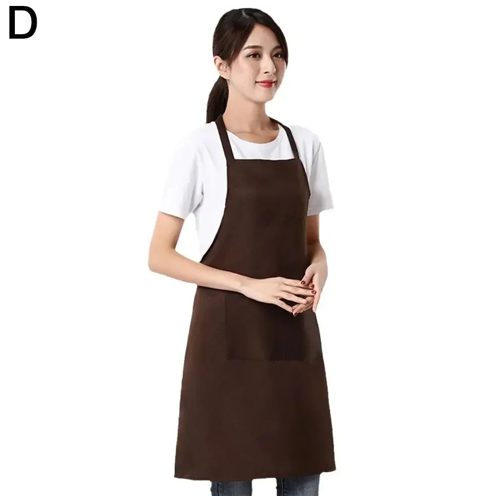 A woman wearing a dark brown waterproof apron with a front pocket.