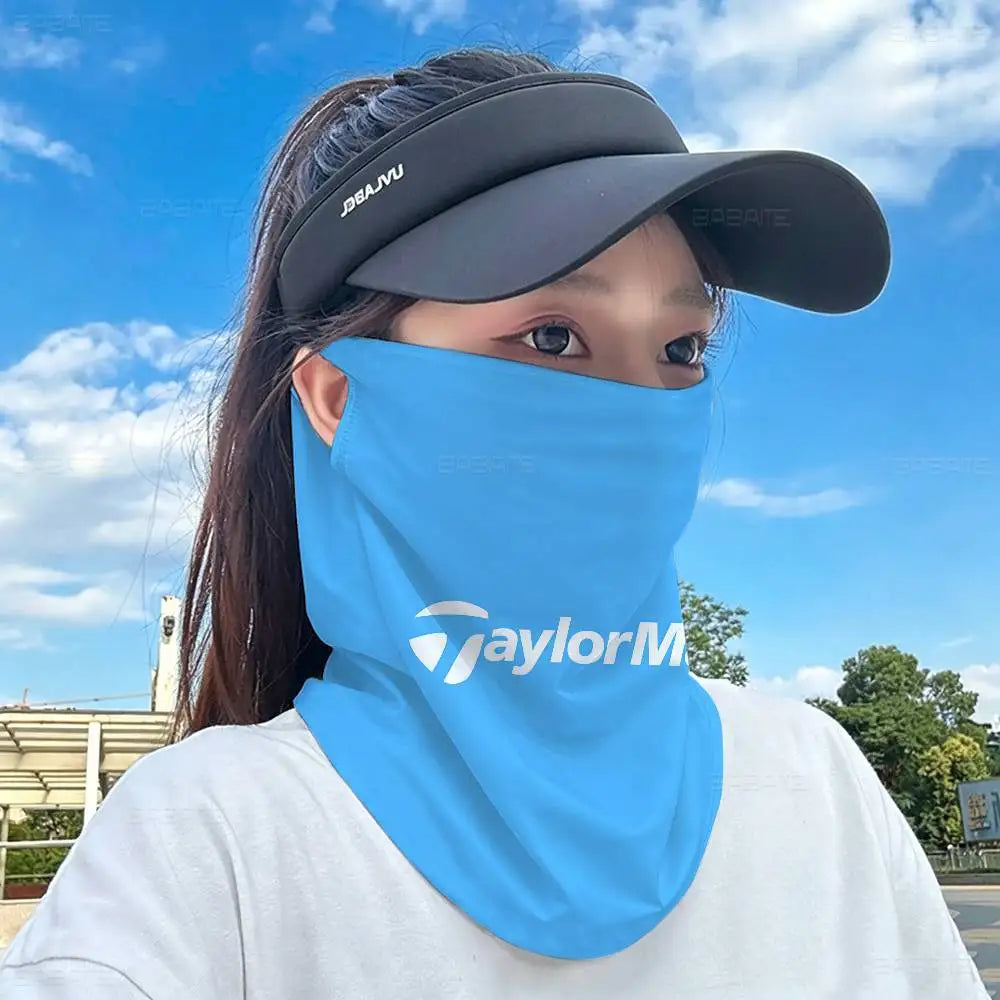 A person wearing a light blue multifunctional neck gaiter and a dark baseball cap outdoors.